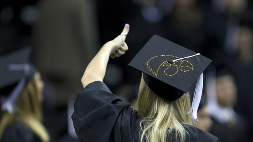 woman wearing black cap and gown