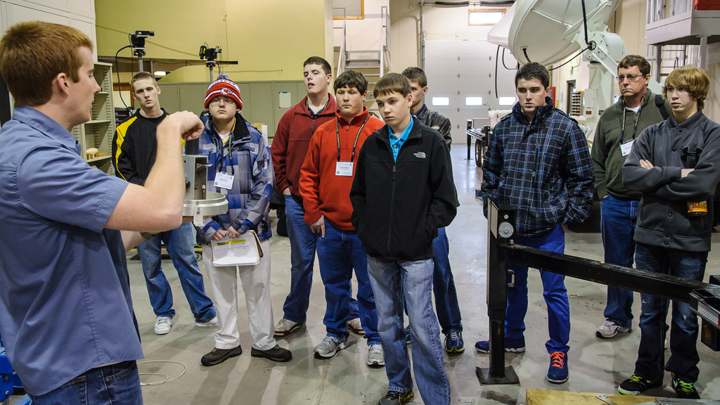 Eight JSHS students and one teacher learn about a rain monitoring device in the Hydrology Lab.