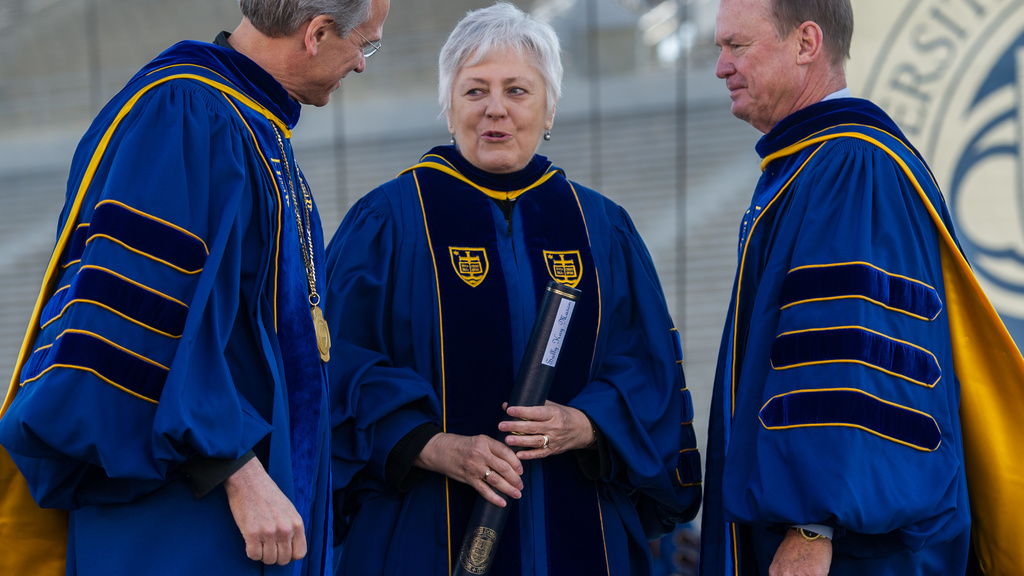 University of Iowa President Mason stands with the Rev. John I. Jenkins, C.S.C., Notre Dame’s president, on the left, and Richard C. Notebaert, chairman of the board of trustees, on the right.  