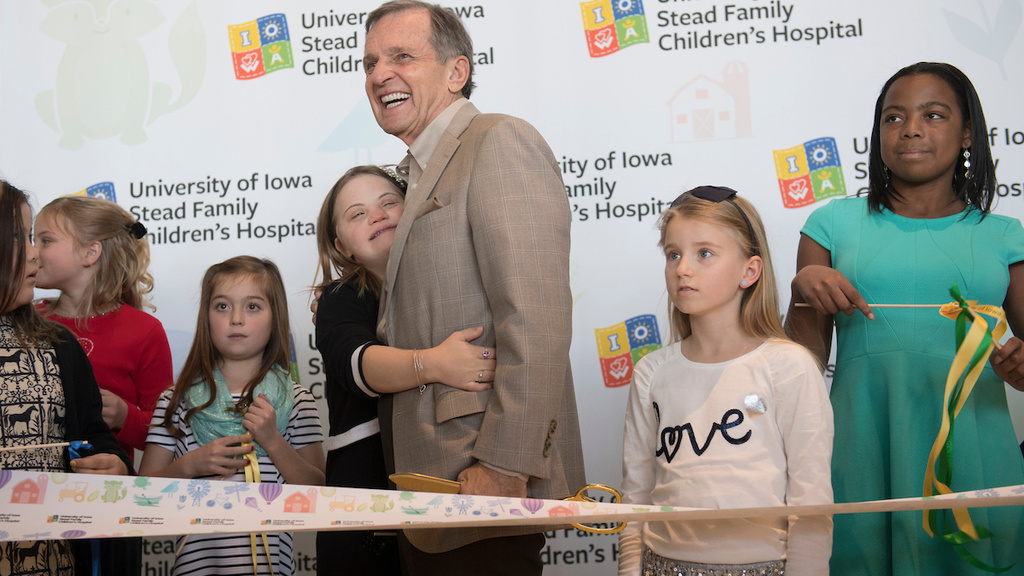 child gives man a hug