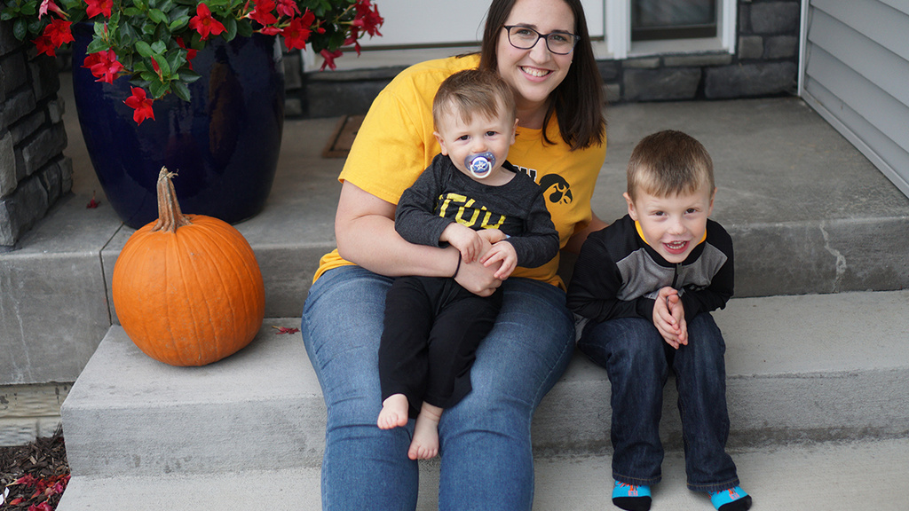 woman sitting on front steps with nephews
