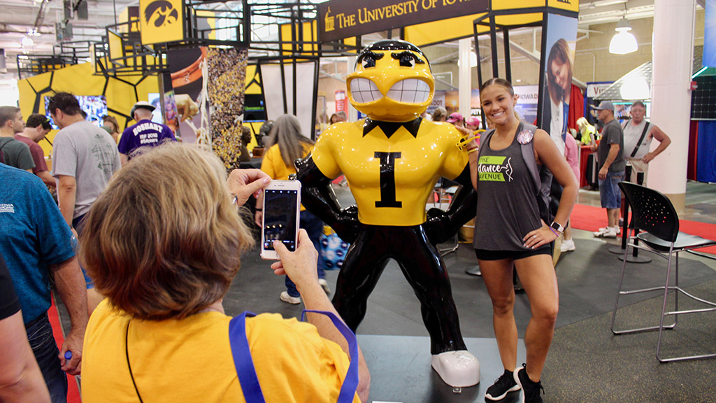 state fair attendee with herky statue