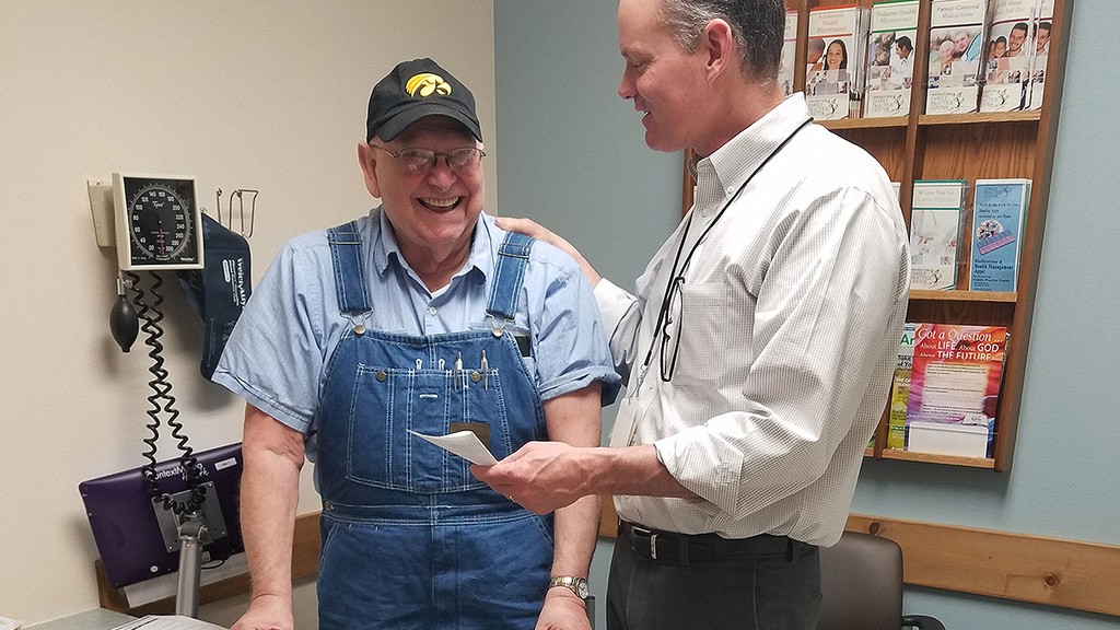 Jim Hoehns assisting a patient in the Northeast Iowa Family Practice Center