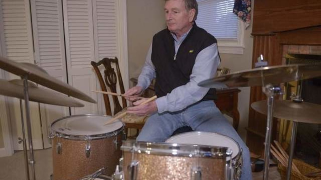 Steve Davis plays his vintage Ludwig drums at his home in Greenville, S.C. He retired in 2005 then went back to working full-time. / Gannett News Service