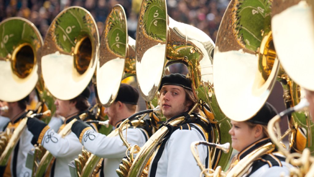 hawkeye marching band members holding instruments