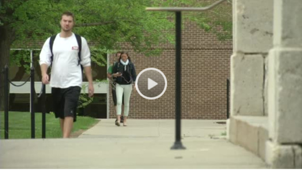 A UI student strolls on campus.
