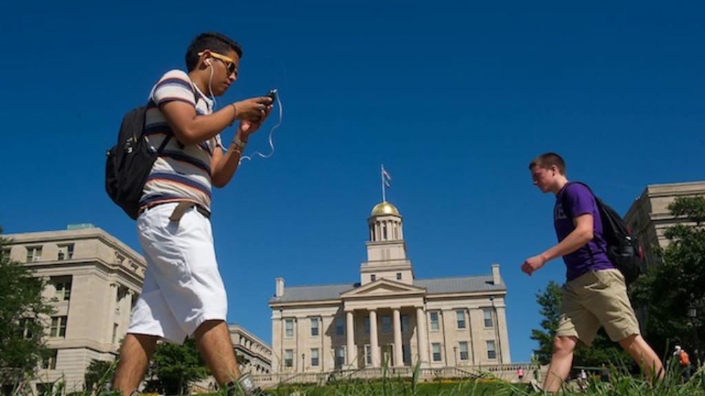 People walking past the Old Capitol building