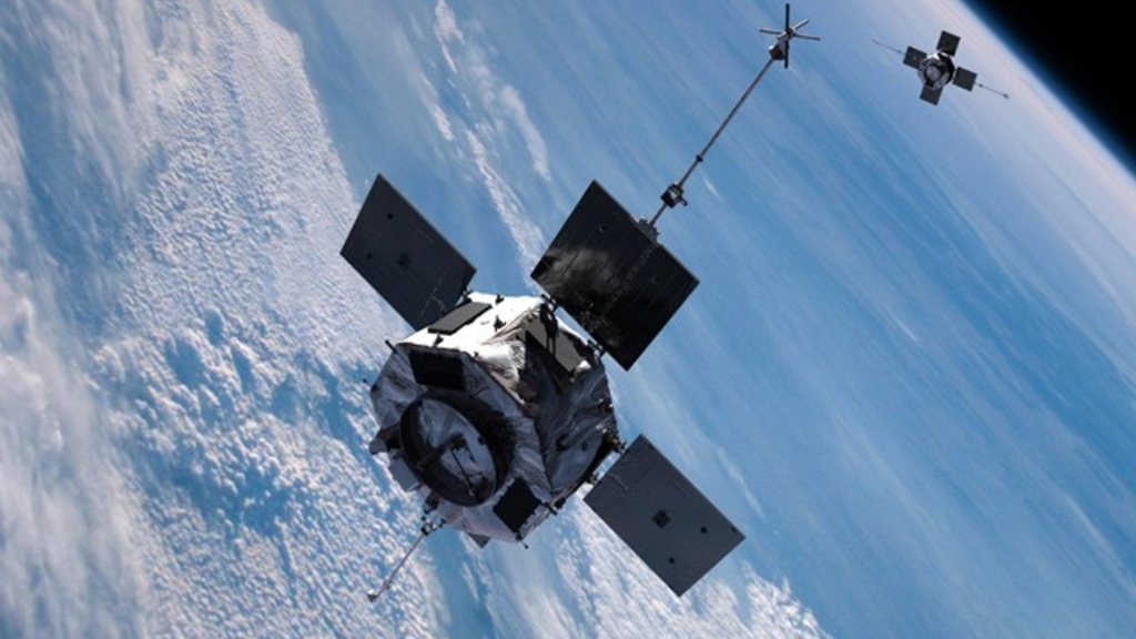 An artist's rendering shows the twin satellites of the Van Allen Probes mission in tandem orbit above the Earth. Image credit: NASA.