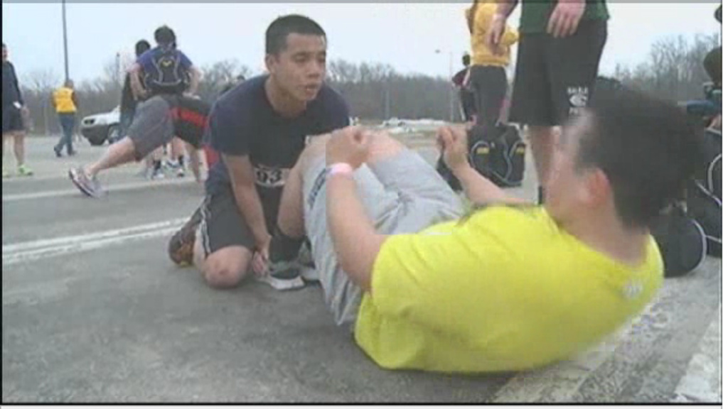 UI student veterans participate in the 2nd Annual Warrior Challenge by doing sit ups during the race.