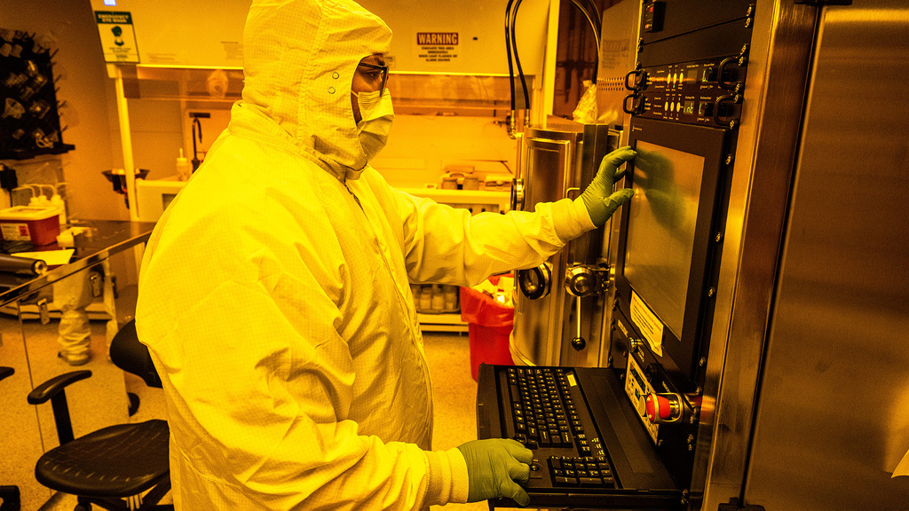 a research professional wearing protective gear works in the Materials Analysis, Testing, and Fabrication (MATFab) Facility