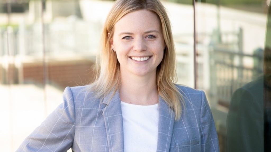 Amanda Elkins, the winner of the 2026 Lola Lopes Award, with medium length blonde hair, parted on the side, wearing a light blue suit jacket and white blouse. 